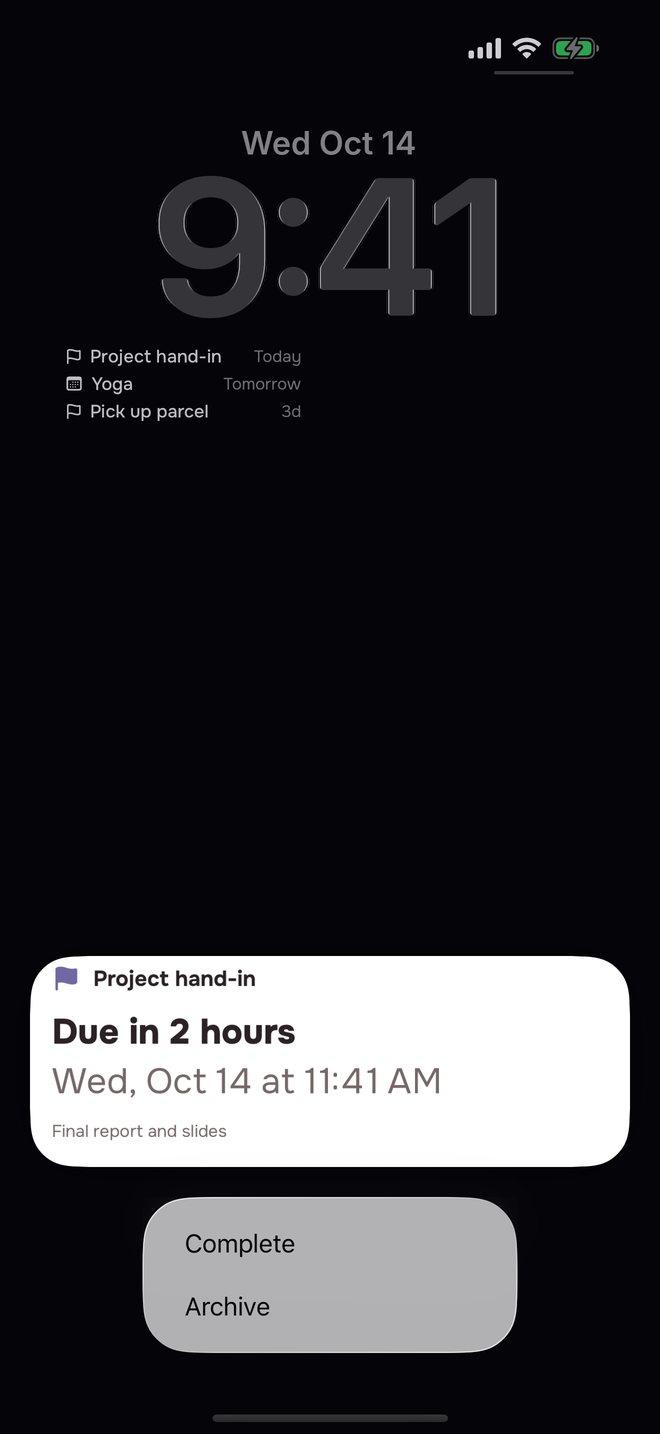 Aheado reminder on the iPhone Lock Screen: Project hand-in, Due in 2 hours, held open with Complete and Archive