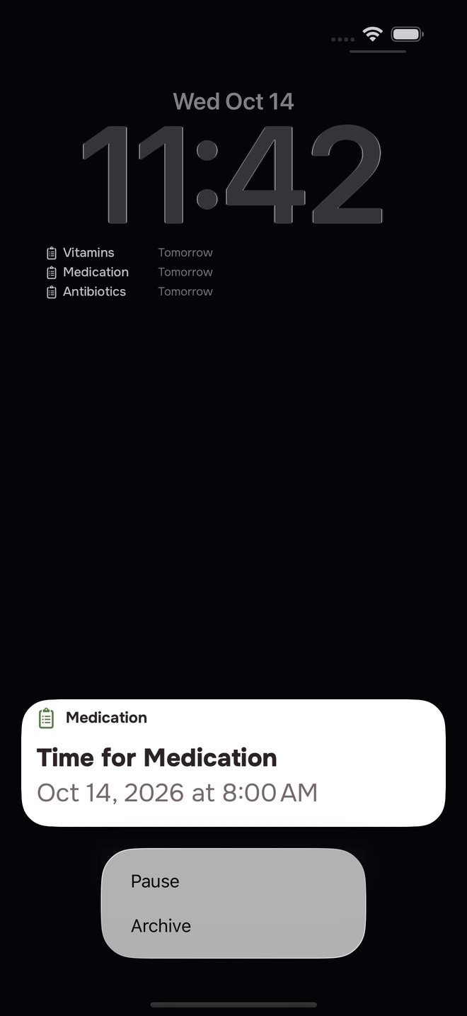 Aheado reminder on the iPhone Lock Screen, held open: Medication, Time for Medication, with Pause and Archive